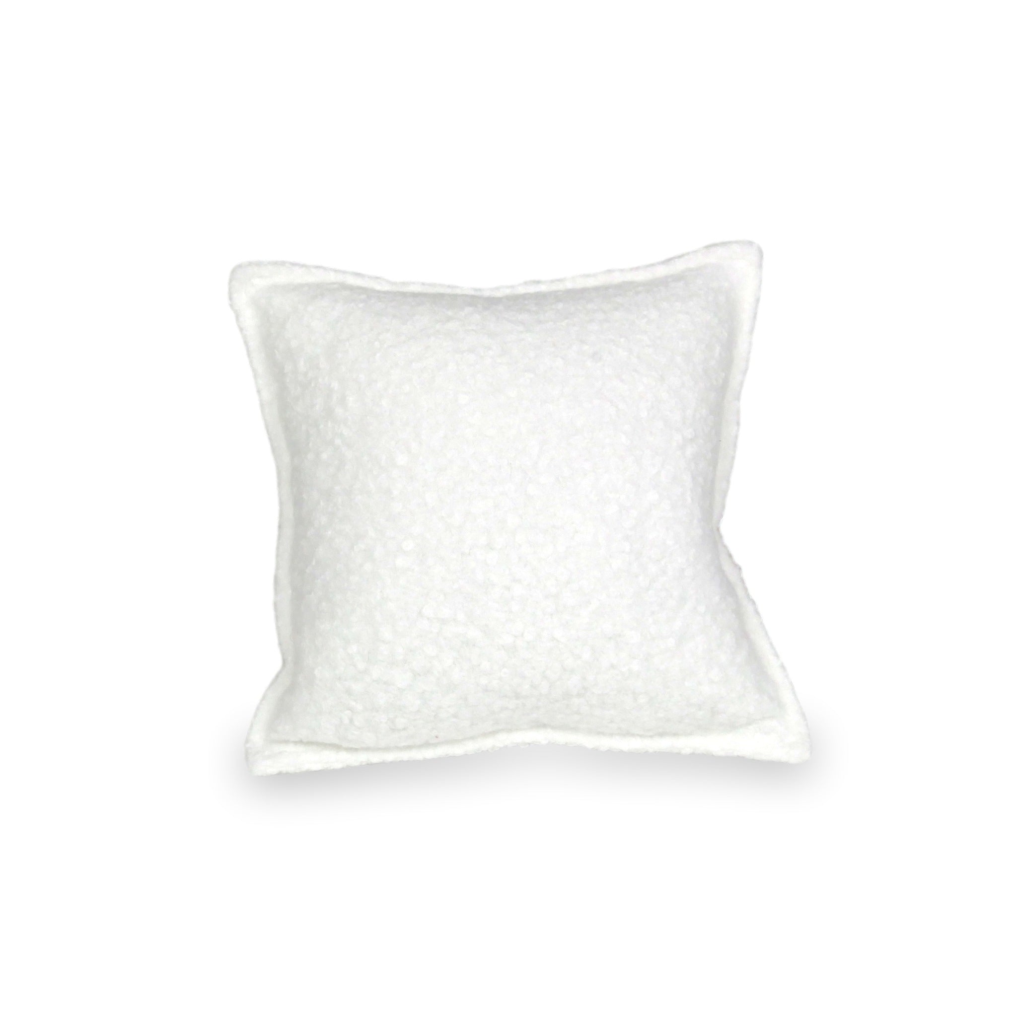 Petit coussin de jeu pour canapé en bouclé blanc